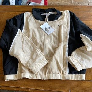 Zyia black n tan windbreaker jacket Sz medium. New w tags.